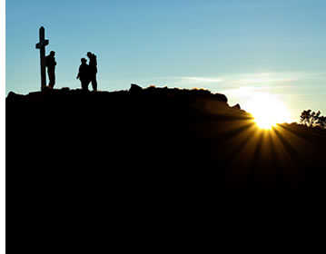 Several hikers at the top of Volcan Baru during sunrise